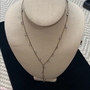 Goldtone “Y” necklace with crystal beveled stones.